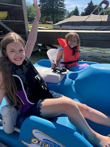 Kids in kayak and boat